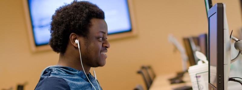 Student working on a computer at the library