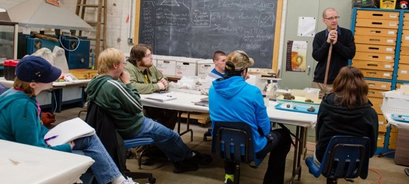 Students and faculty in a classroom.