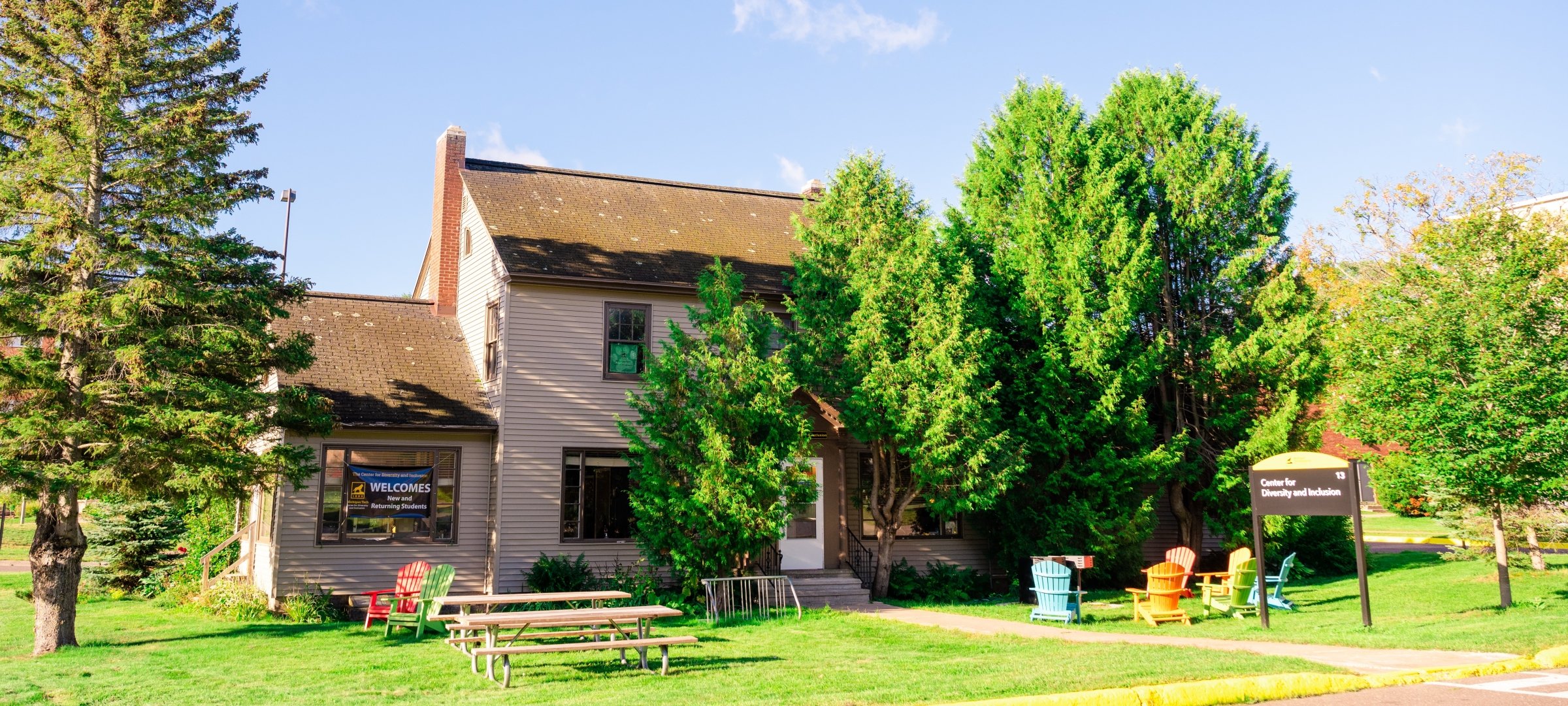 The outside of the Hamar House, where the Center for Diversity and Inclusion is located, in summer.