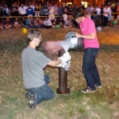 Two men pouring liquid nitrogen 