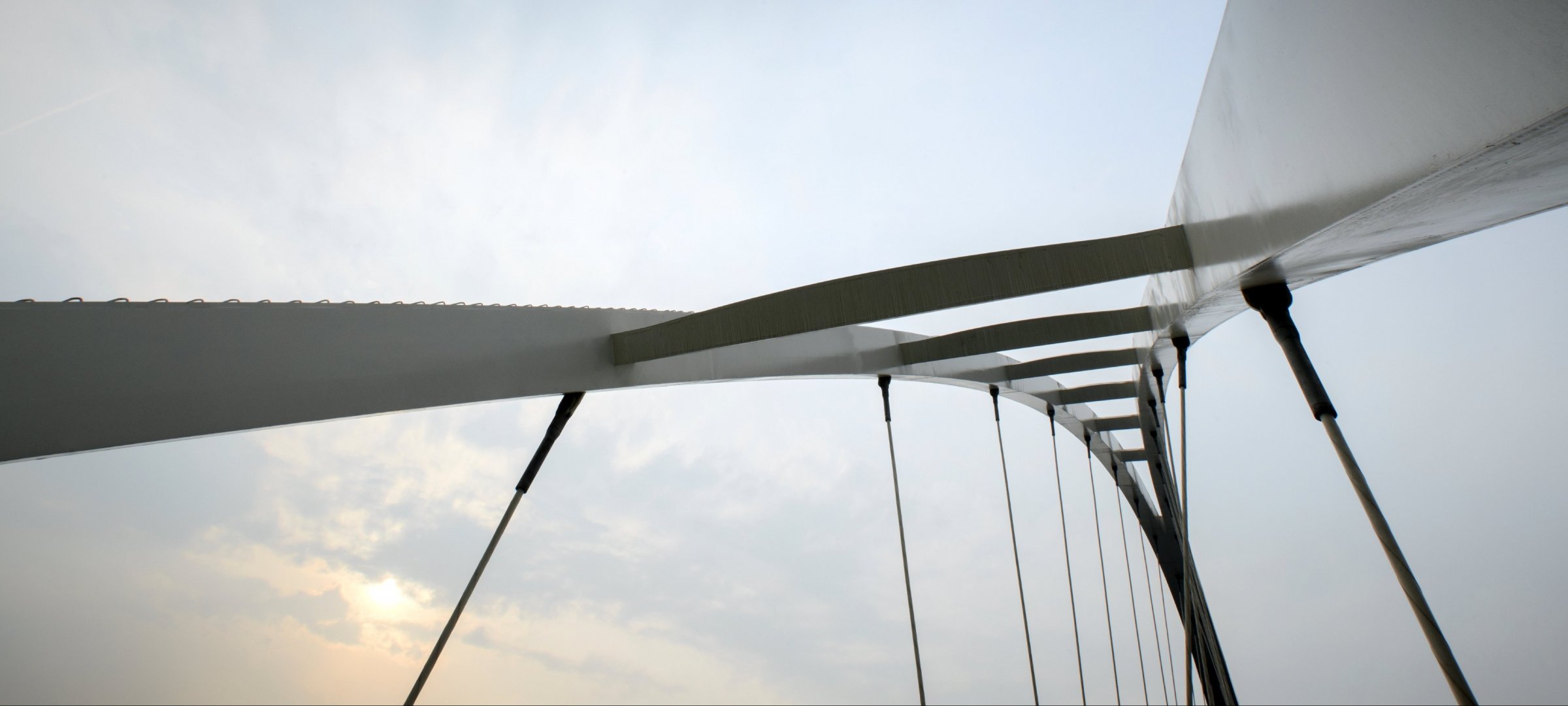 Looking up towards the rafters of a bridge