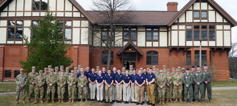 Air Force ROTC cadets in OCP's standing in front of the Michigan Tech ROTC building.