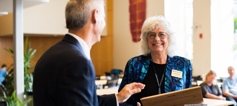 Faculty member receiving an award.