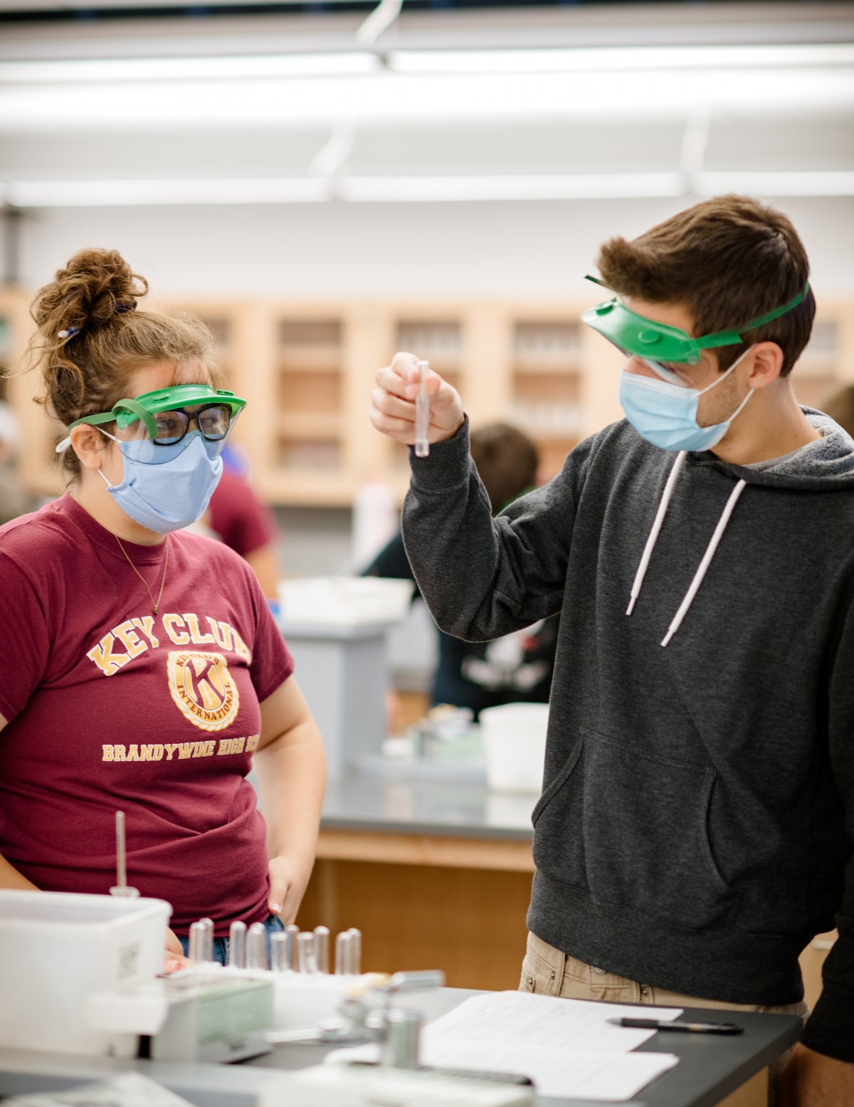 Undergraduate students in a lab with protective gear