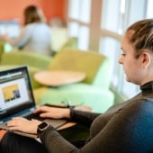 Student working at a laptop.