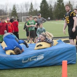 students practicing football