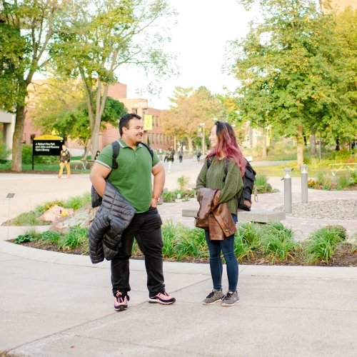 Students on Michigan Tech campus visiting information tables