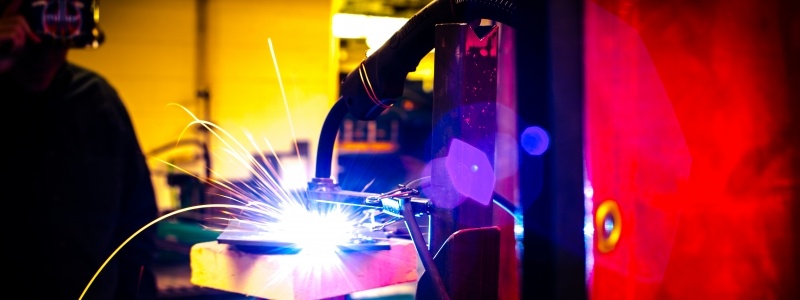 Sparks fly as someone welds.