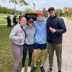 A group of students at the end of Pi Mile