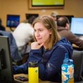 Student works at a computer in the library.